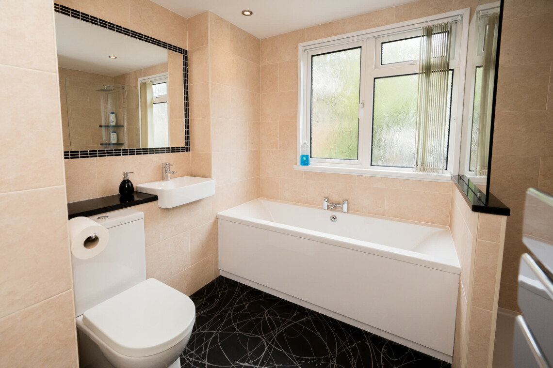 Family bathroom with bath and shower