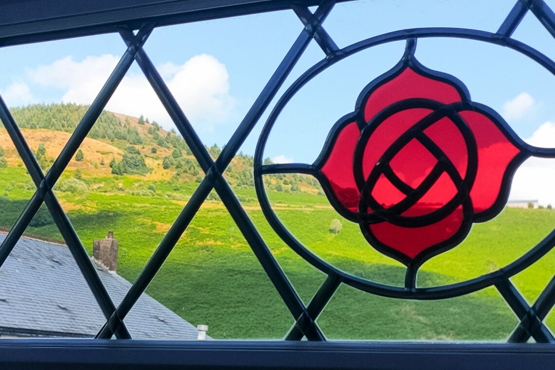 Stain glass window & scenic view.=