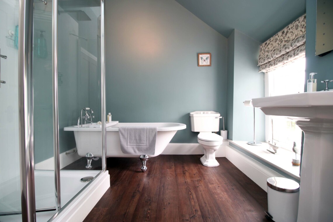 Modern bathroom with shower and free standing bath
