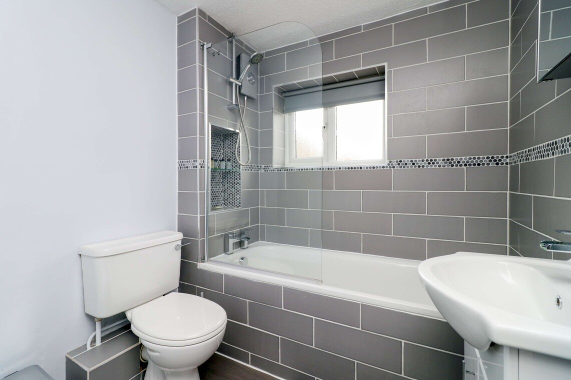 Bathroom with shower over bath