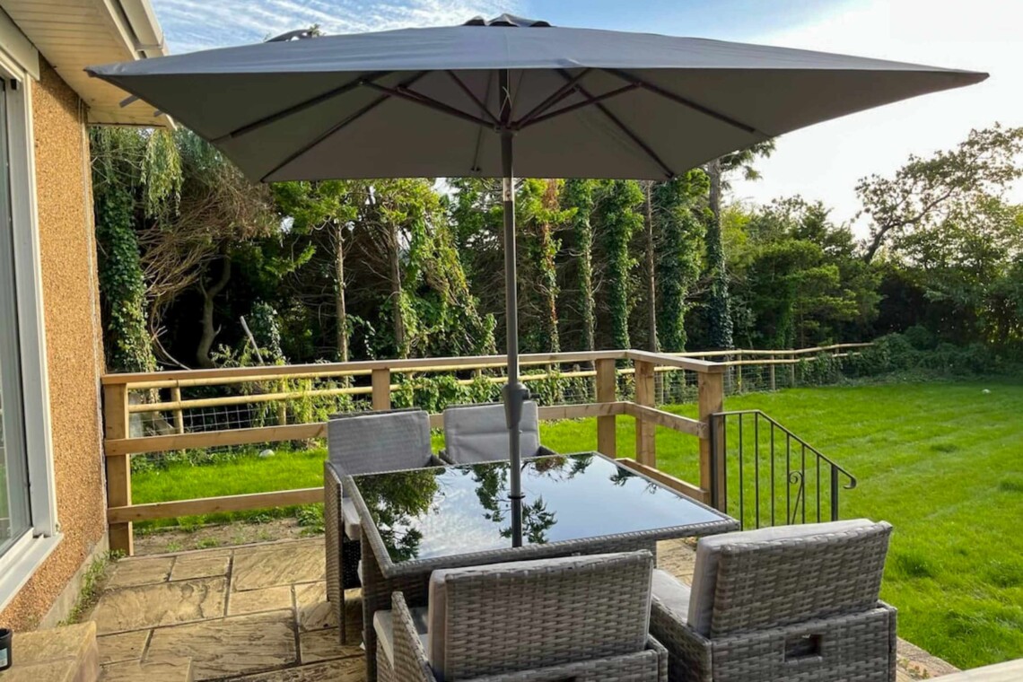 Patio area overlooking a large garden