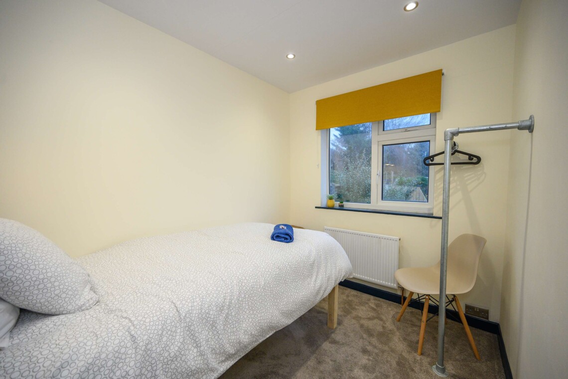 Open plan living area which contains comfortable sofa where you can relax watching the widescreen smart TV.