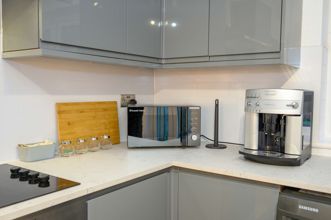 Open plan living area which contains comfortable sofa where you can relax watching the widescreen smart TV.