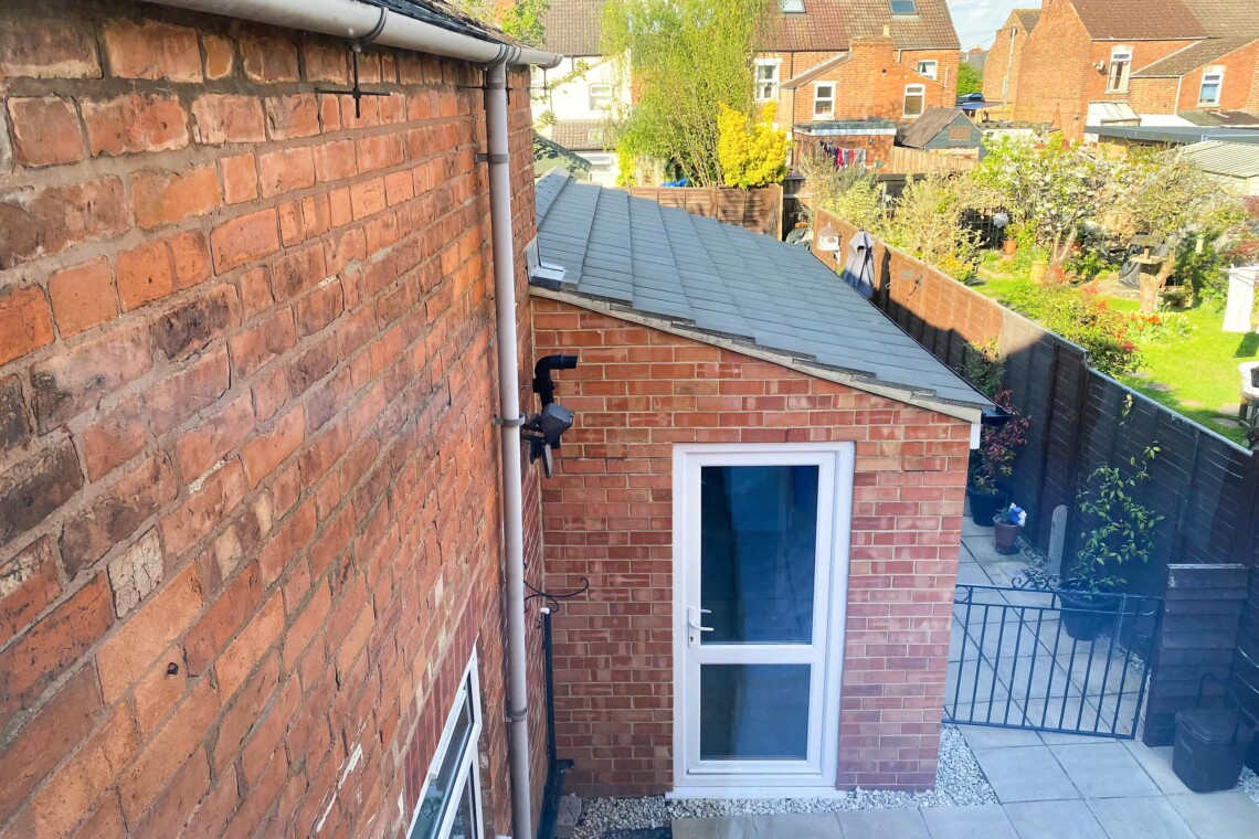Side entrance and gate to garden