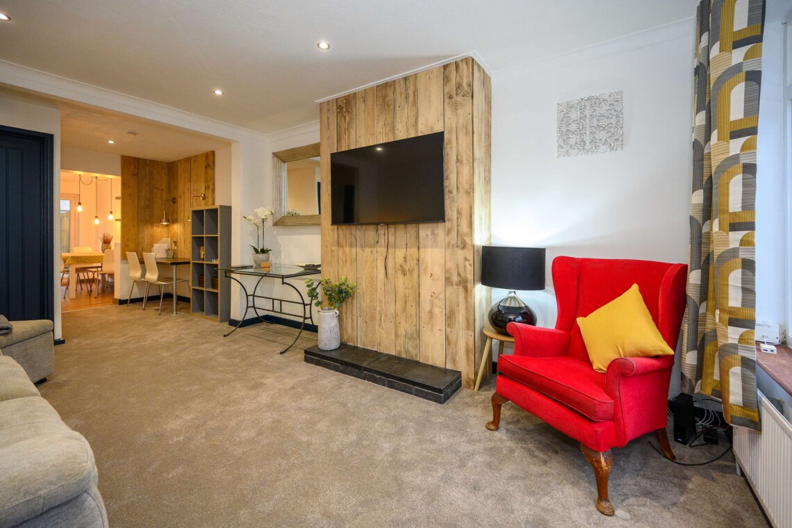 Open plan living area which contains comfortable sofa where you can relax watching the widescreen smart TV.