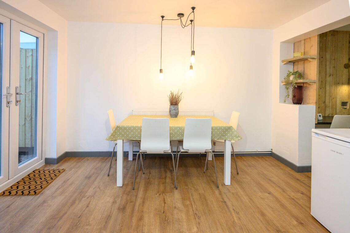 Open plan living area which contains comfortable sofa where you can relax watching the widescreen smart TV.