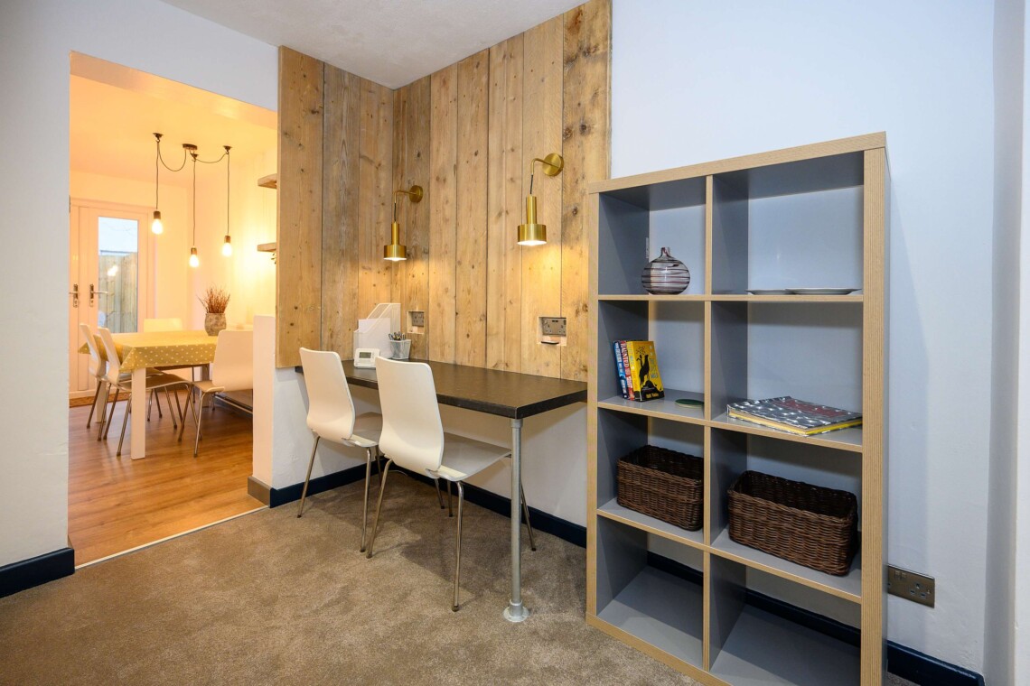 Open plan living area which contains comfortable sofa where you can relax watching the widescreen smart TV.