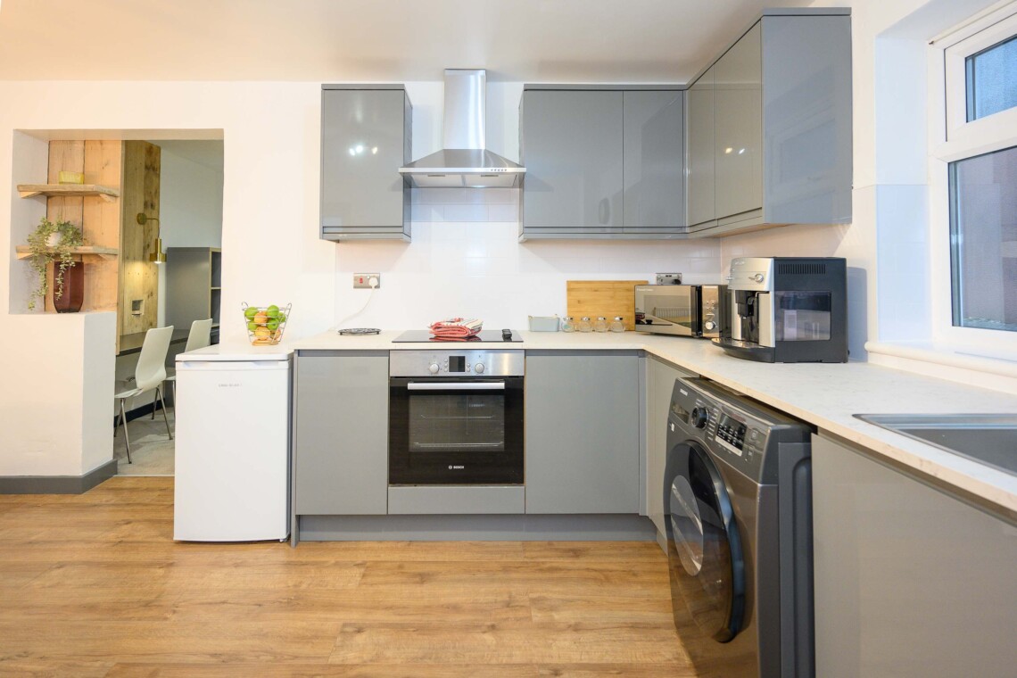 Open plan living area which contains comfortable sofa where you can relax watching the widescreen smart TV.