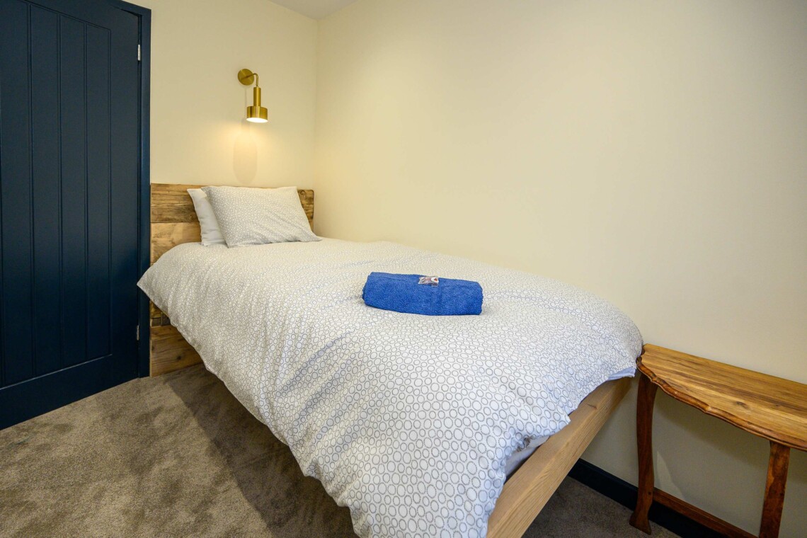 Open plan living area which contains comfortable sofa where you can relax watching the widescreen smart TV.