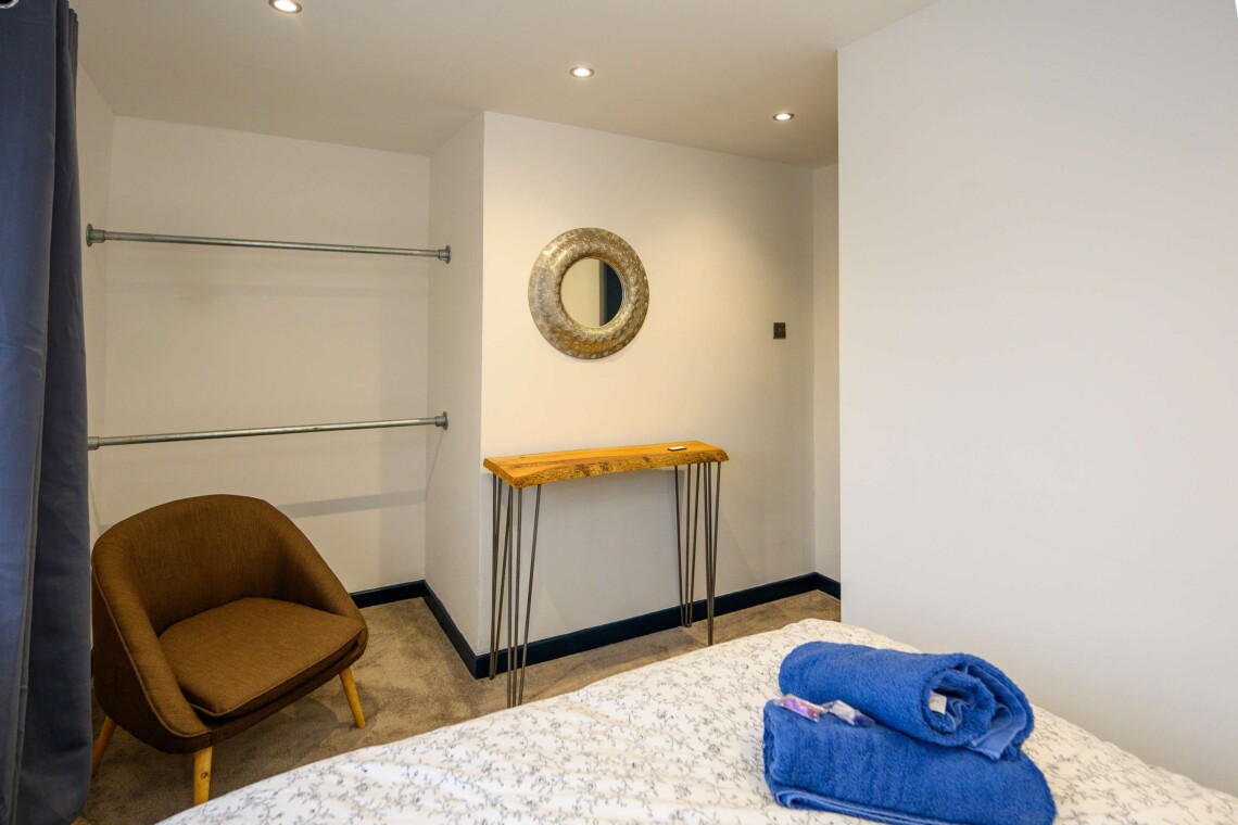 Open plan living area which contains comfortable sofa where you can relax watching the widescreen smart TV.