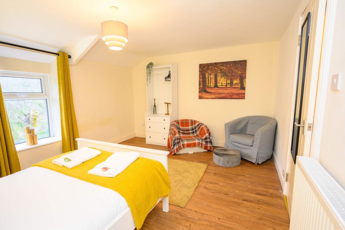 Double bedroom seating area and storage