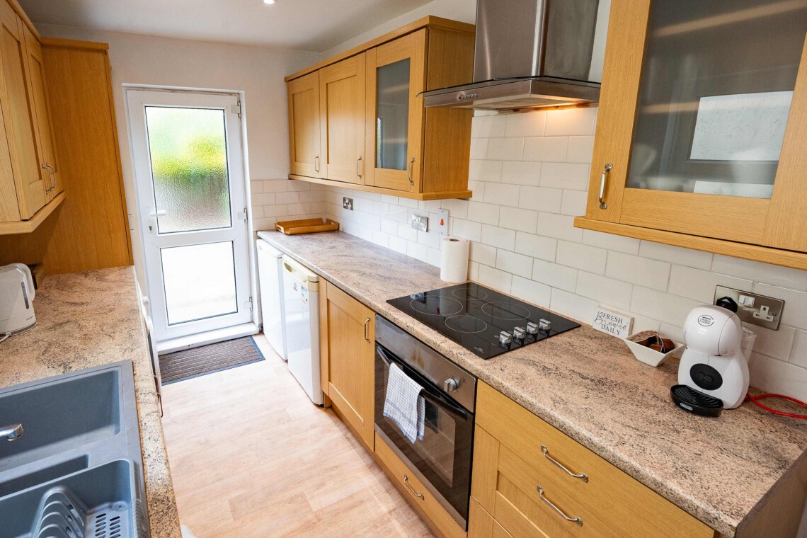 Fully equipped kitchen provides all essential amenities, including a hob, oven, crockery, toaster, kettle, washer, and a coffee machine