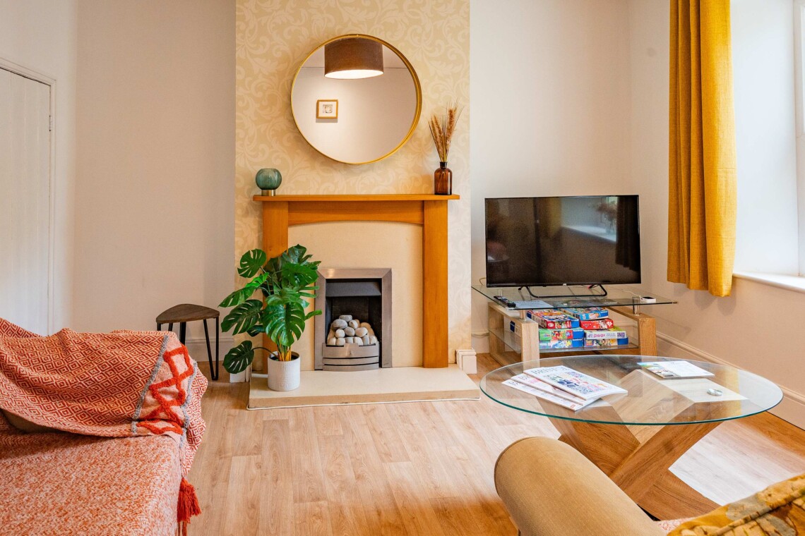 Living room, multimedia TV & a selection of board games 