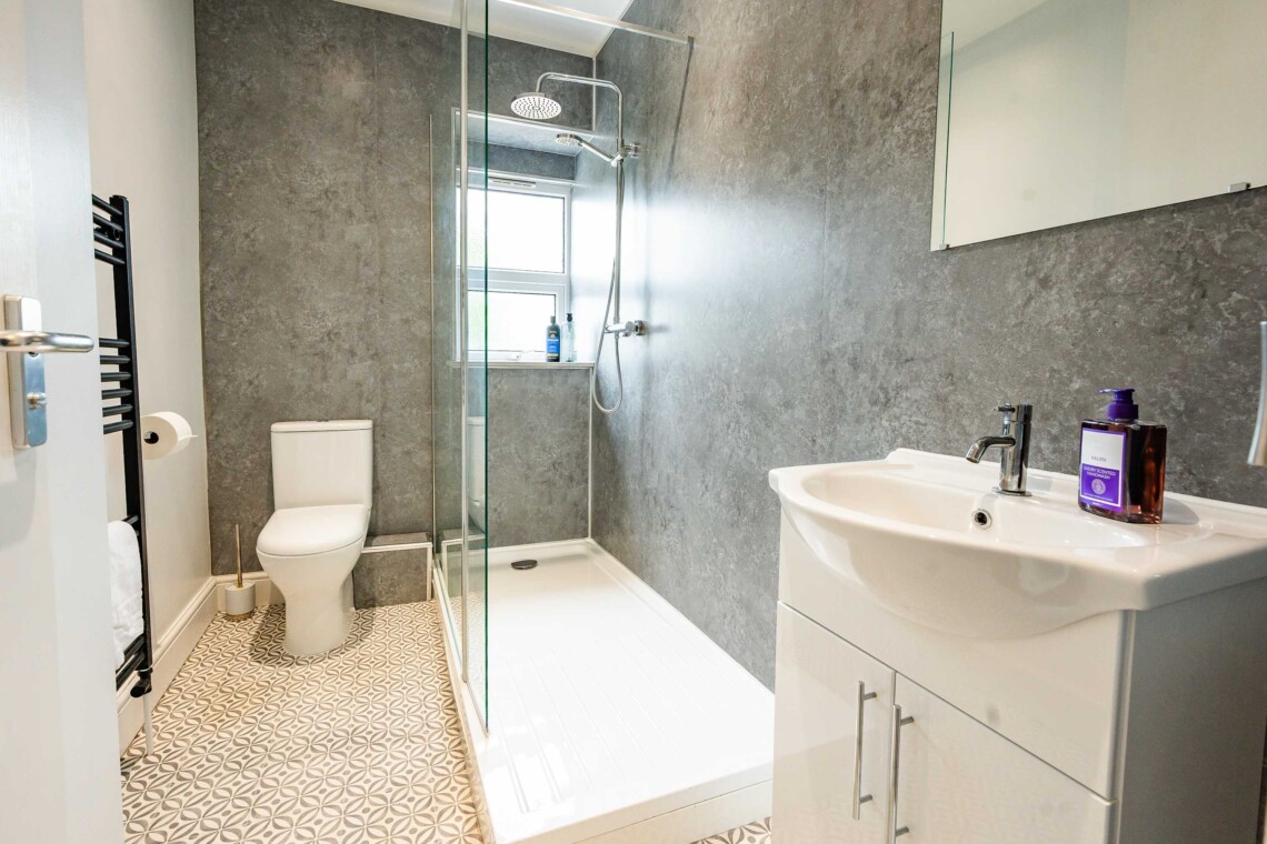 Bathroom with spacious multi-head shower