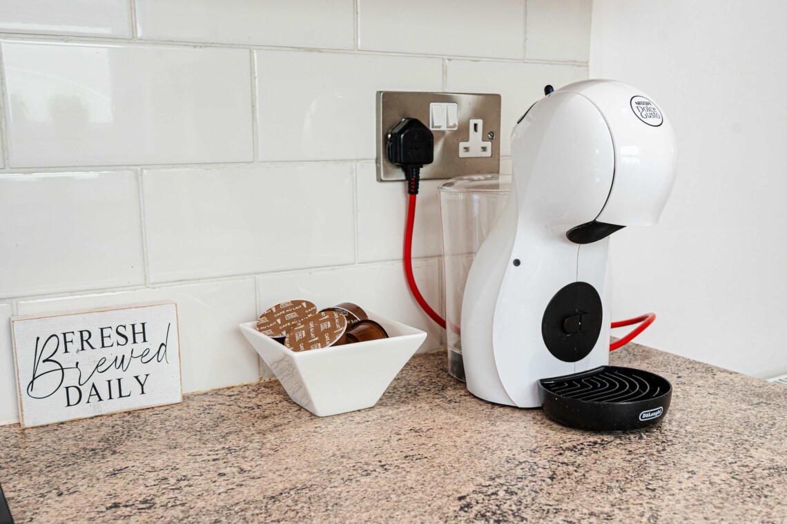 Fully equipped kitchen provides all essential amenities, including a hob, oven, crockery, toaster, kettle, washer, and a coffee machine