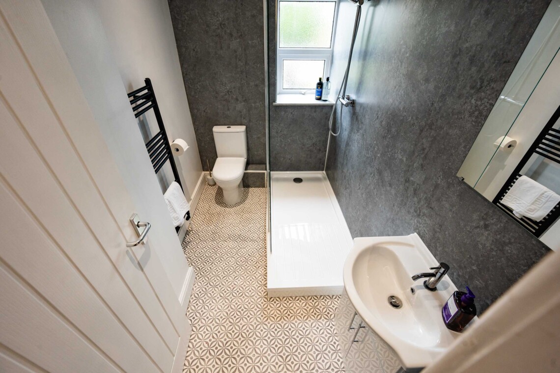 Bathroom with spacious multi-head shower