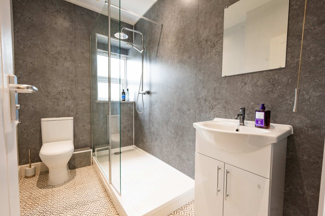 Bathroom with spacious multi-head shower