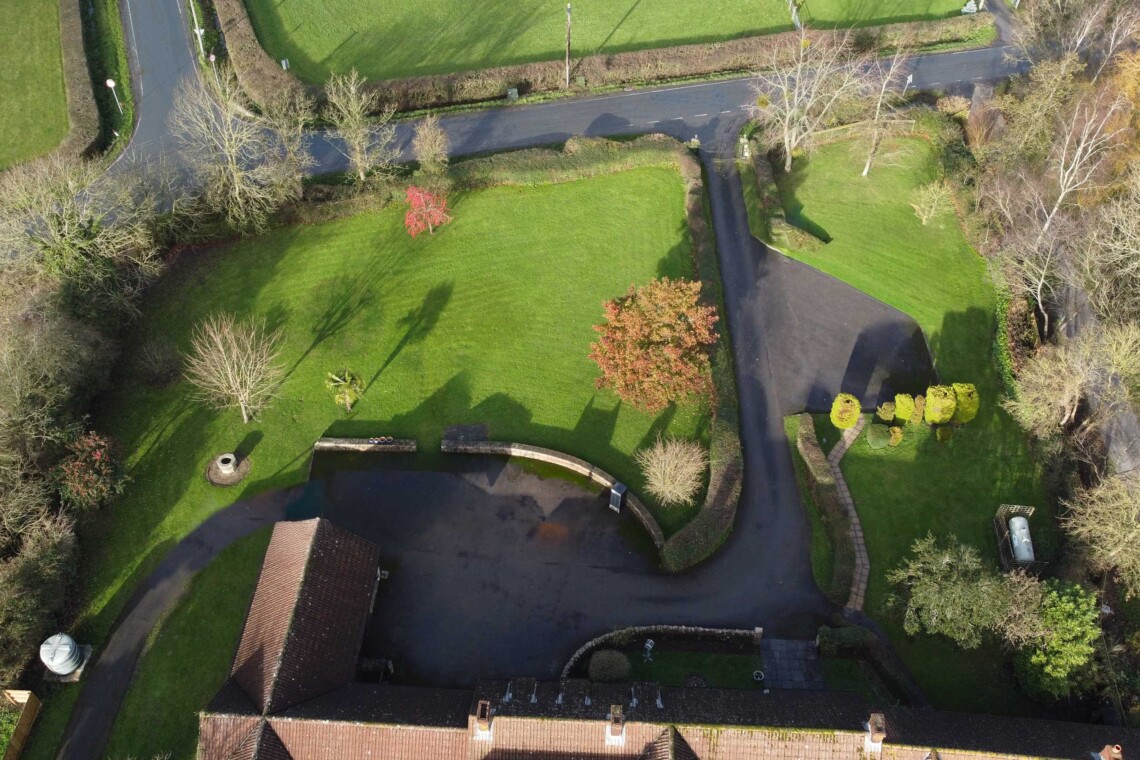 Aerial view of front gardens and gated entrance