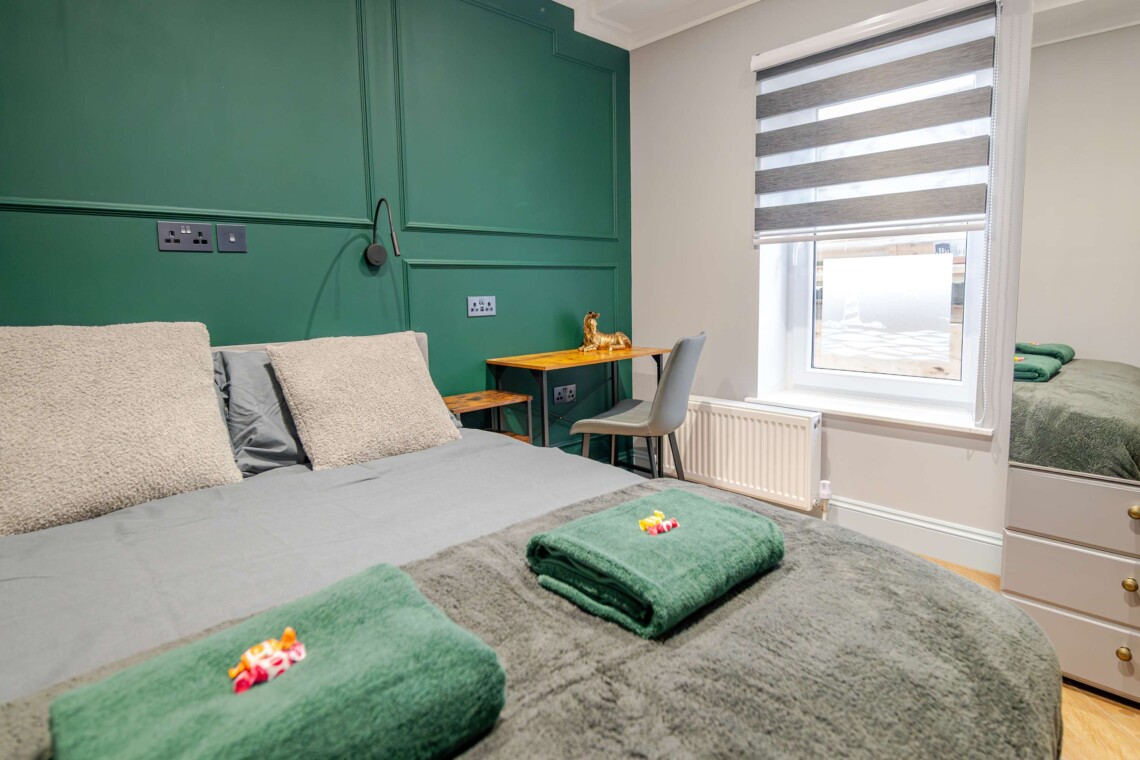 Bedroom with a seat & small table