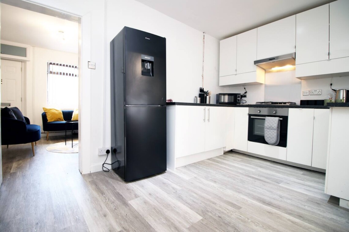 The fully equipped kitchen is ready for your culinary adventures, with everything you need to make delicious homemade meals. 