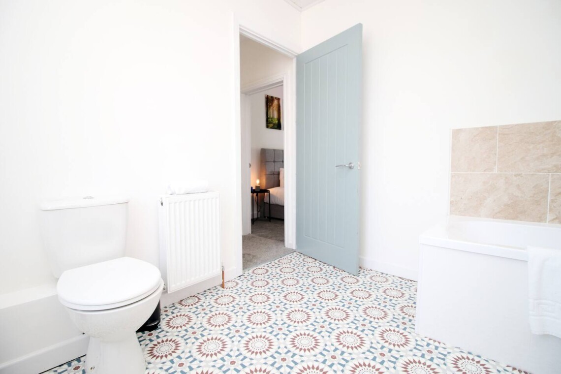 Full bathroom is also located on this floor, ensuring convenience for all guests