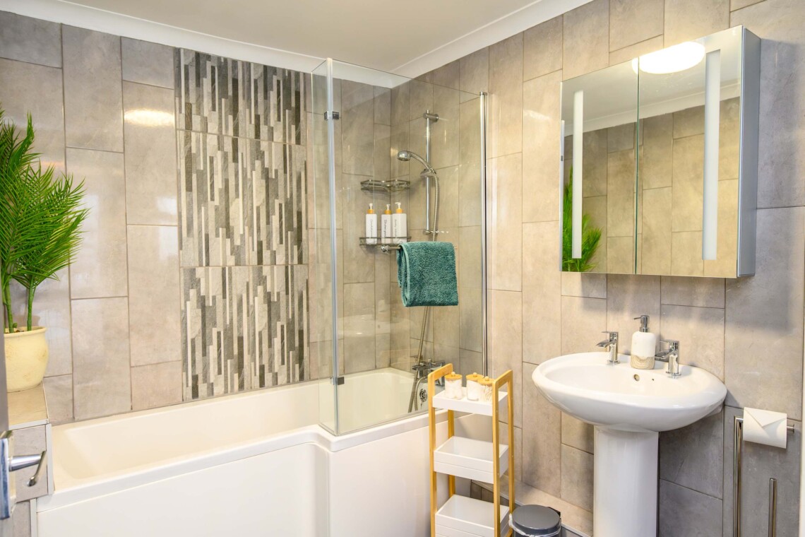 Bathroom with shower over bath