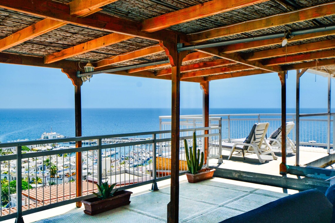 Shaded part of the roof terrace with incredible views looking out over Playa de Mogan and the marina