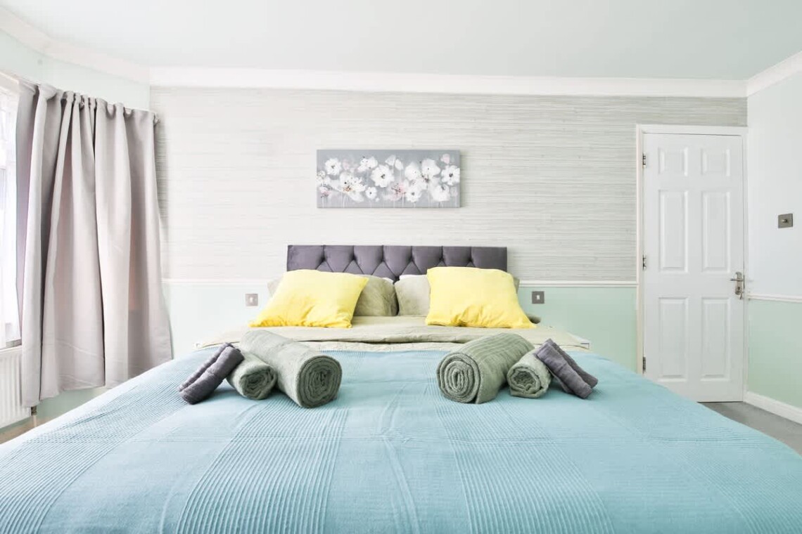 Spacious and bright, with a king-size bed and a convenient work area.