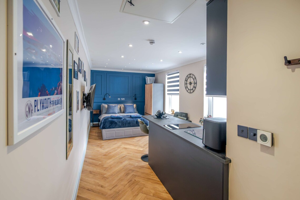 A cosy lounge includes a sofa, smart TV and dining table for your nights in