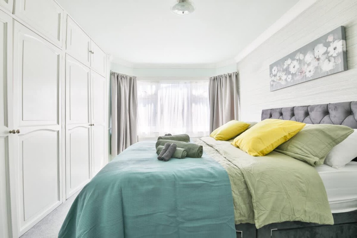 Spacious and bright, with a king-size bed and a convenient work area.