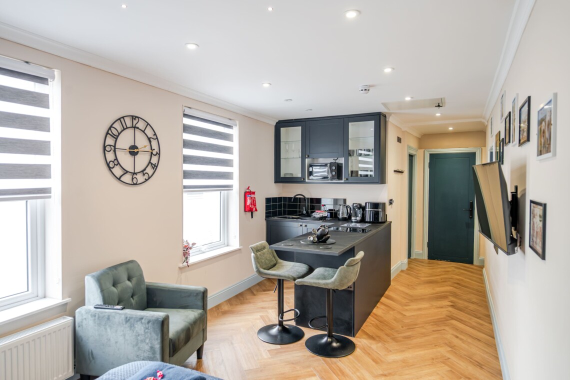 The apartment features a single-level layout, with an open plan living area and kitchen