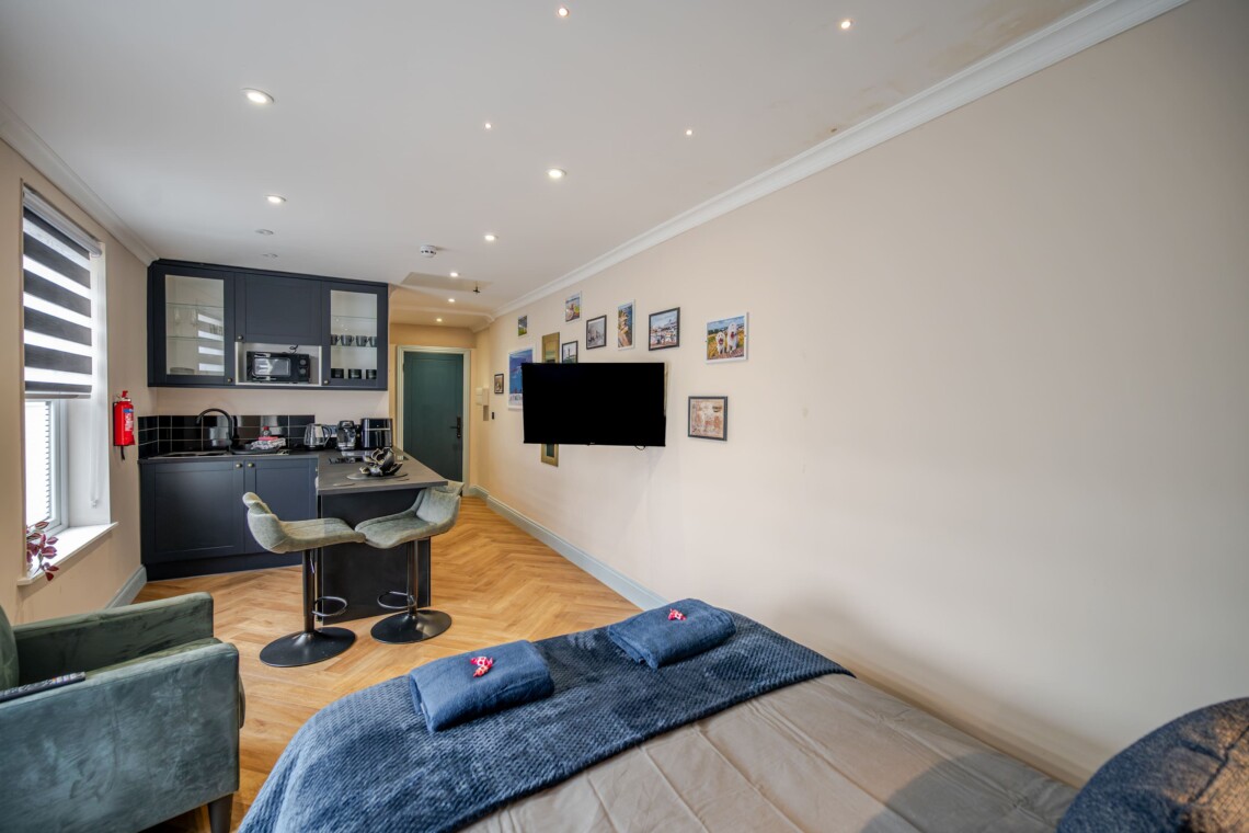 A cosy lounge includes sofa, smart TV and dining table for your nights in.