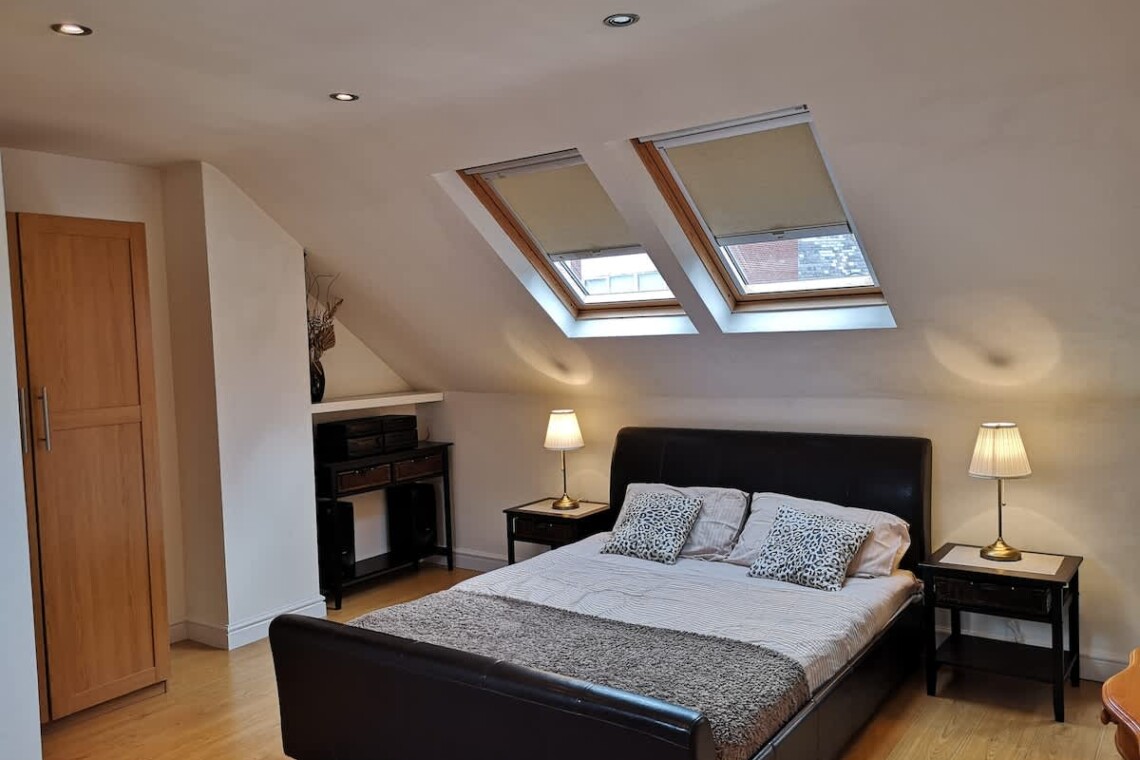 A large, private retreat with a king-size bed, desk, and mini fridge—ideal for longer stays or added privacy.