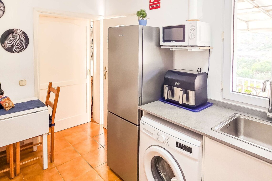 Fully equipped modern kitchen with everything you need for a comfortable stay. Facilities include a washing machine, air fryer, coffee machine, kettle, toaster, and all the crockery and cutlery required for easy self-catering