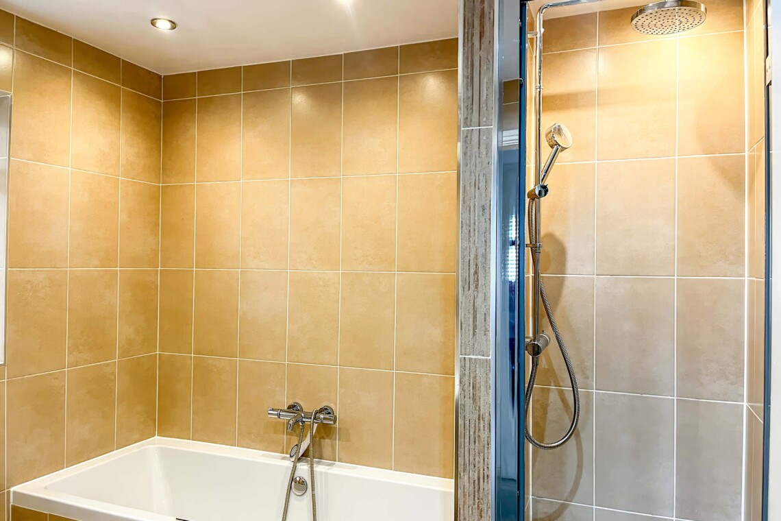 Full bathroom with shower and bath