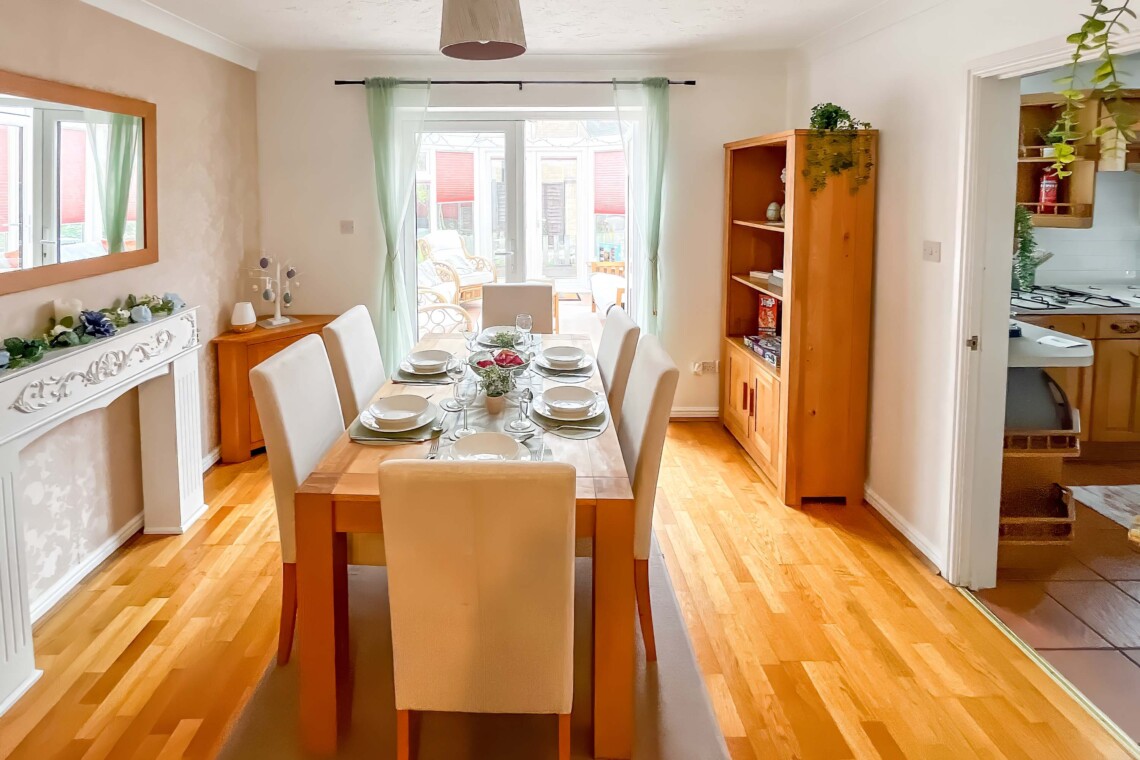 Dining area, featuring a generous table and six comfortable chairs. 