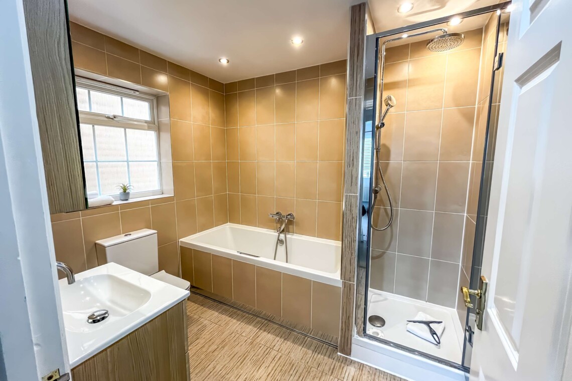 Full bathroom with shower and bath