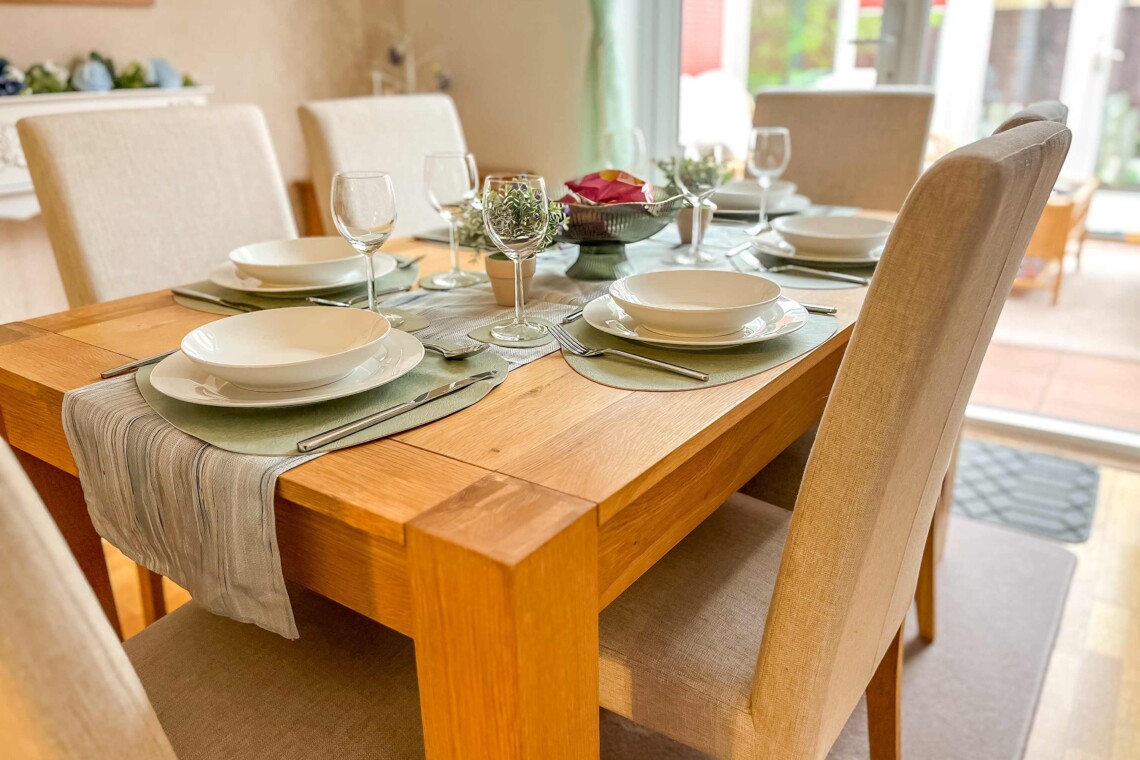 Dining area, featuring a generous table and six comfortable chairs. 