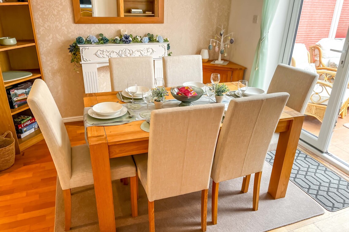 Dining area, featuring a generous table and six comfortable chairs. 