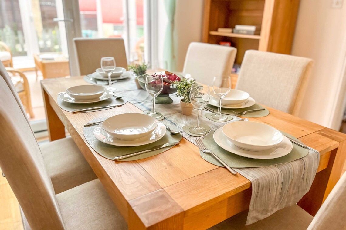 Dining area, featuring a generous table and six comfortable chairs. 