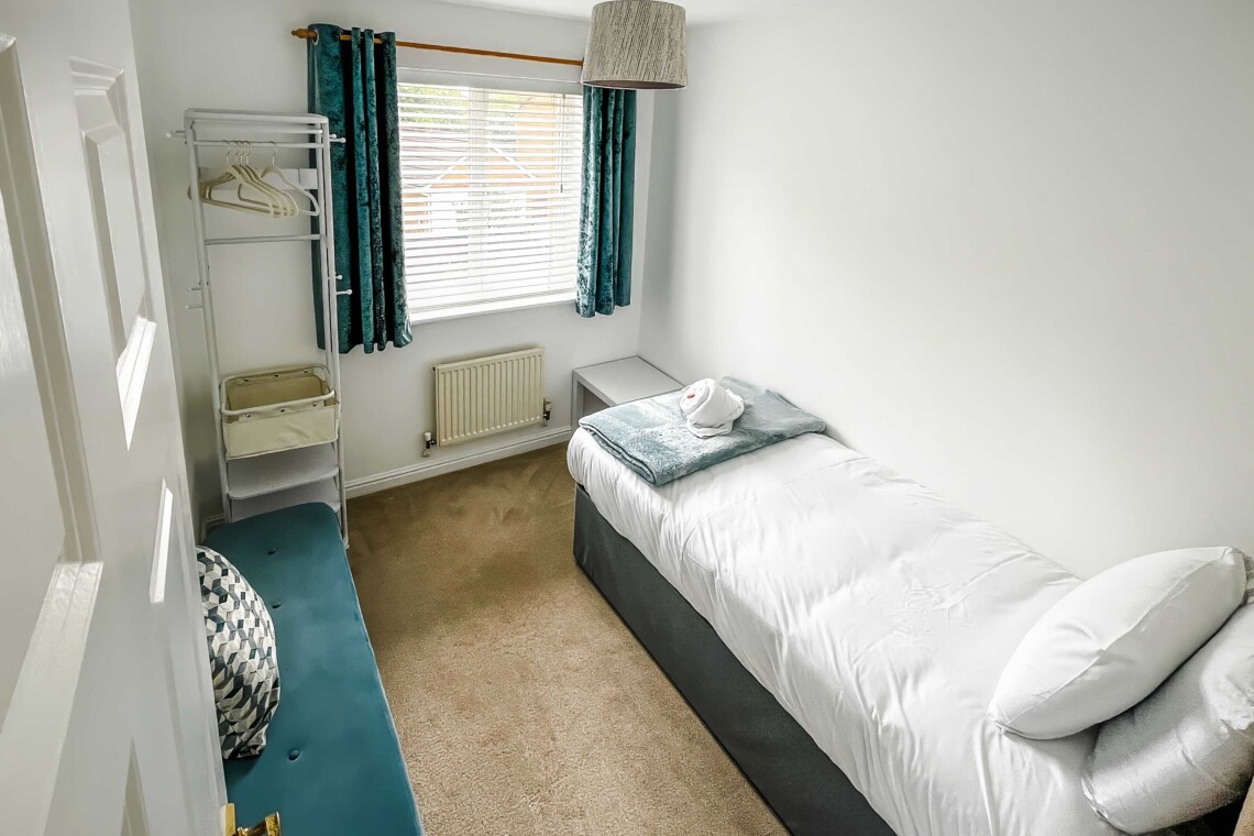 Bedroom three, features a comfortable single bed.