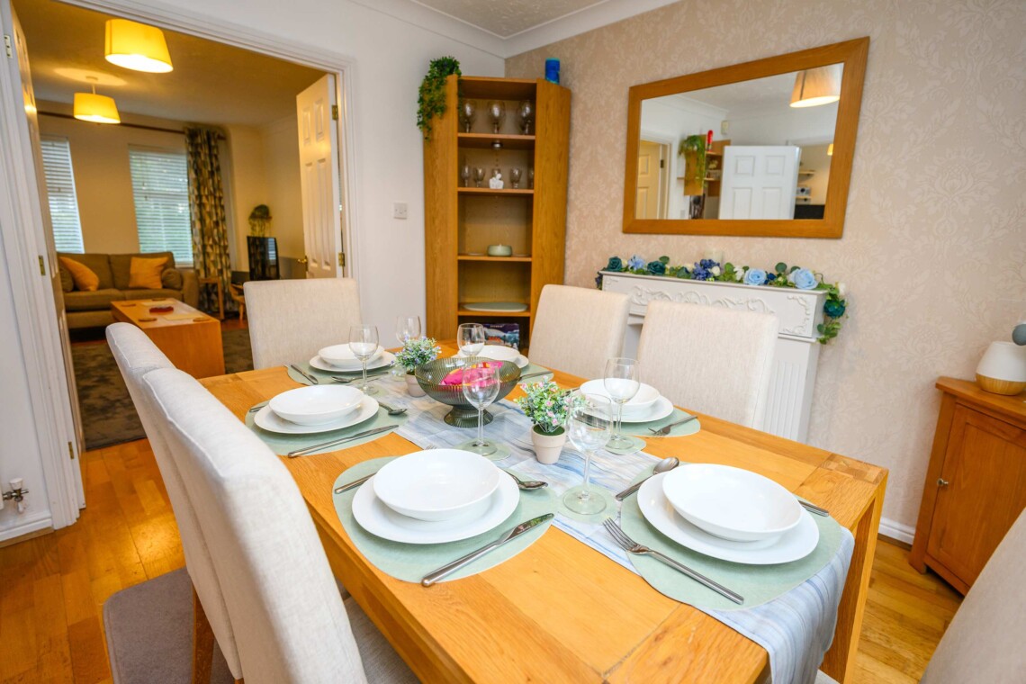 Dining area, featuring a generous table and six comfortable chairs. 
