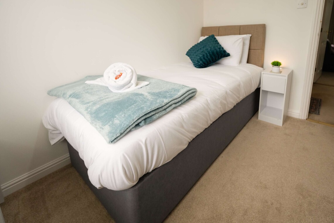 Bedroom three features a comfortable single bed.