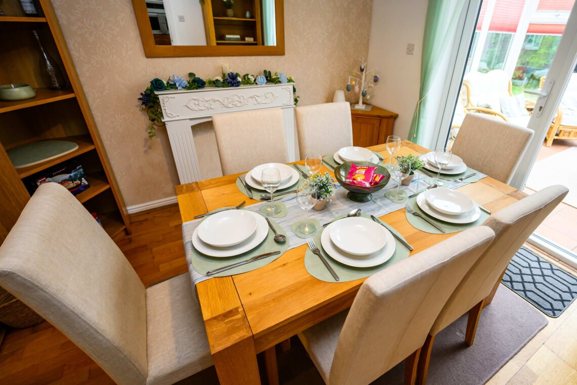 Dining area, featuring a generous table and six comfortable chairs. 