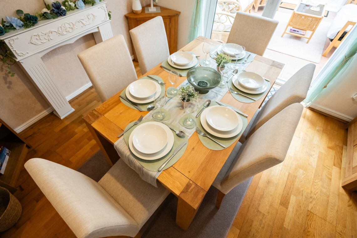Dining area, featuring a generous table and six comfortable chairs. 