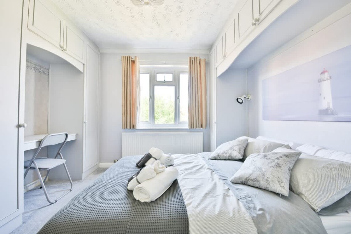 Peaceful and overlooking the rear garden; this room features a comfortable double bed.