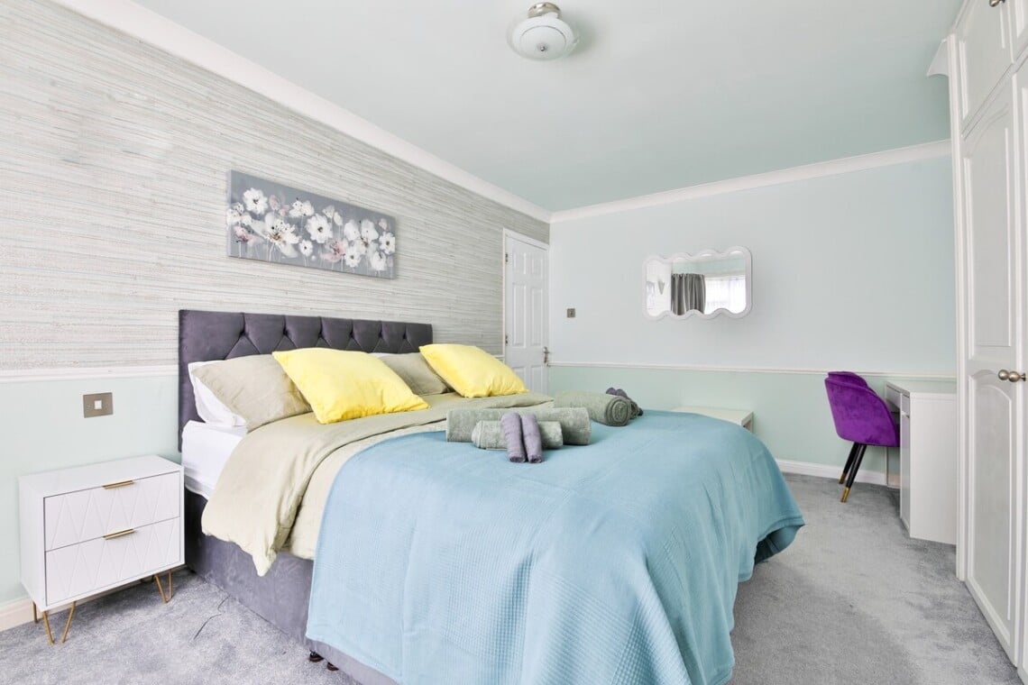 Spacious and bright, with a king-size bed and a convenient work area.
