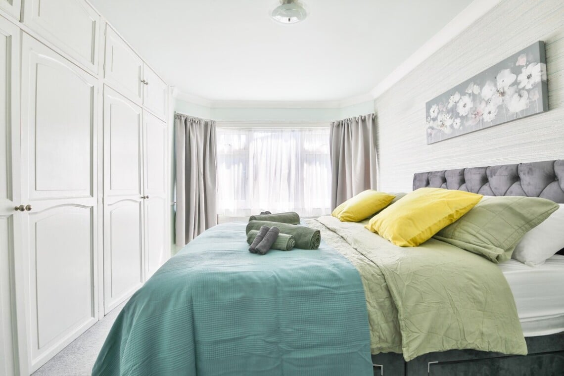 Spacious and bright, with a king-size bed and a convenient work area.